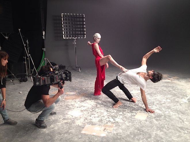 IMAGE: Dancers behind-the-scenes, in the red dress